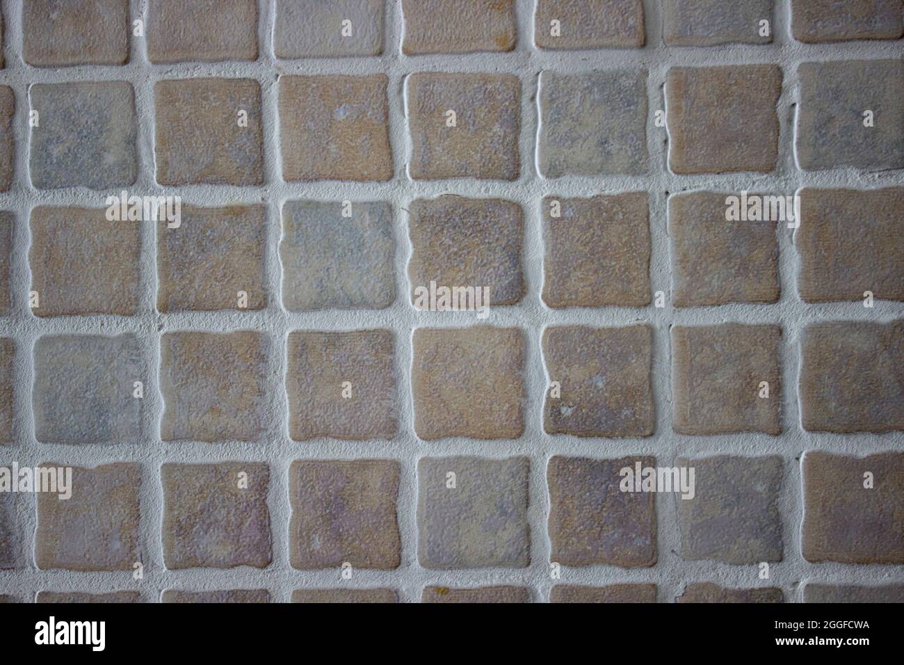 Red and grey stone tiled wall texture Stock Photo