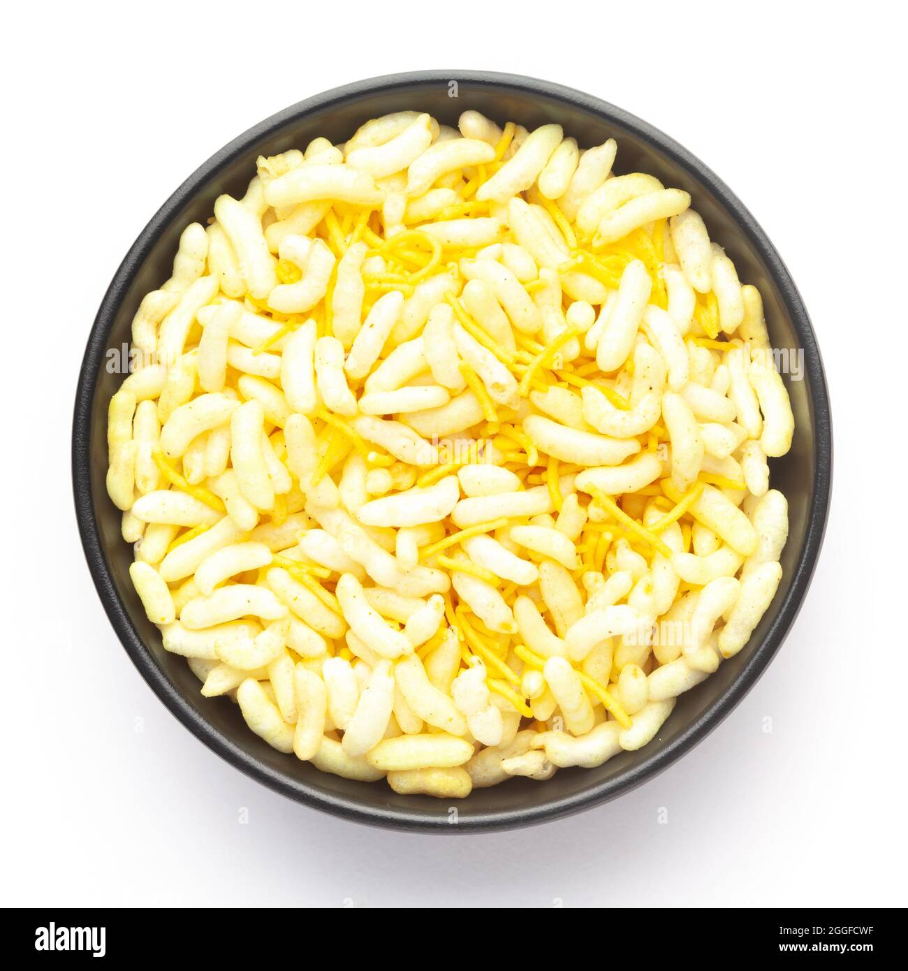 Close-Up of Crunchy Lemon Bhel in a black ceramic bowl made with Puffed Rice small besan sev. Indian spicy snacks (Namkeen), Top View Stock Photo