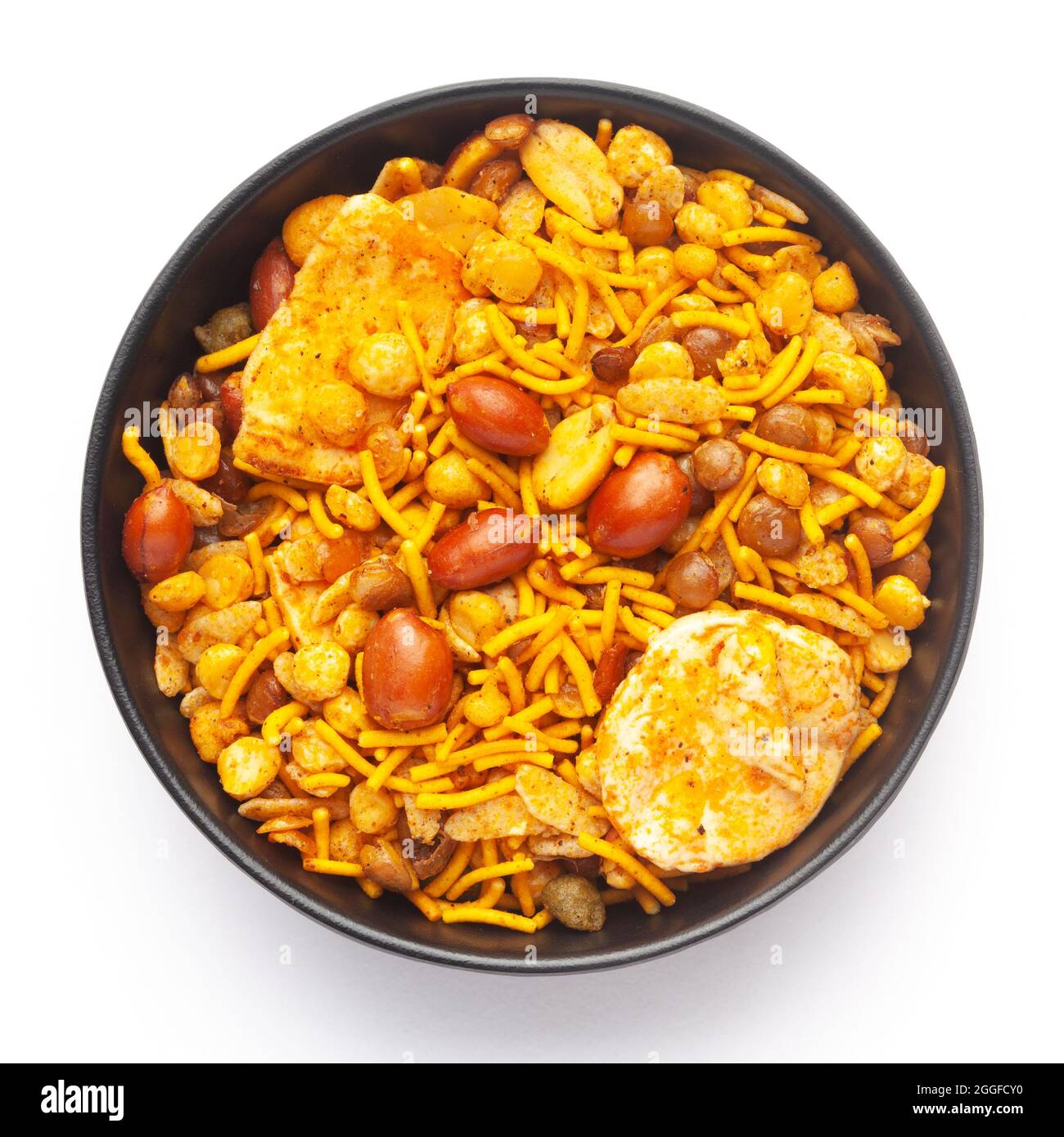 CloseUp of Hot spicy Nav Ratan snacks in a black Ceramic bowl, made with red chili, peanuts