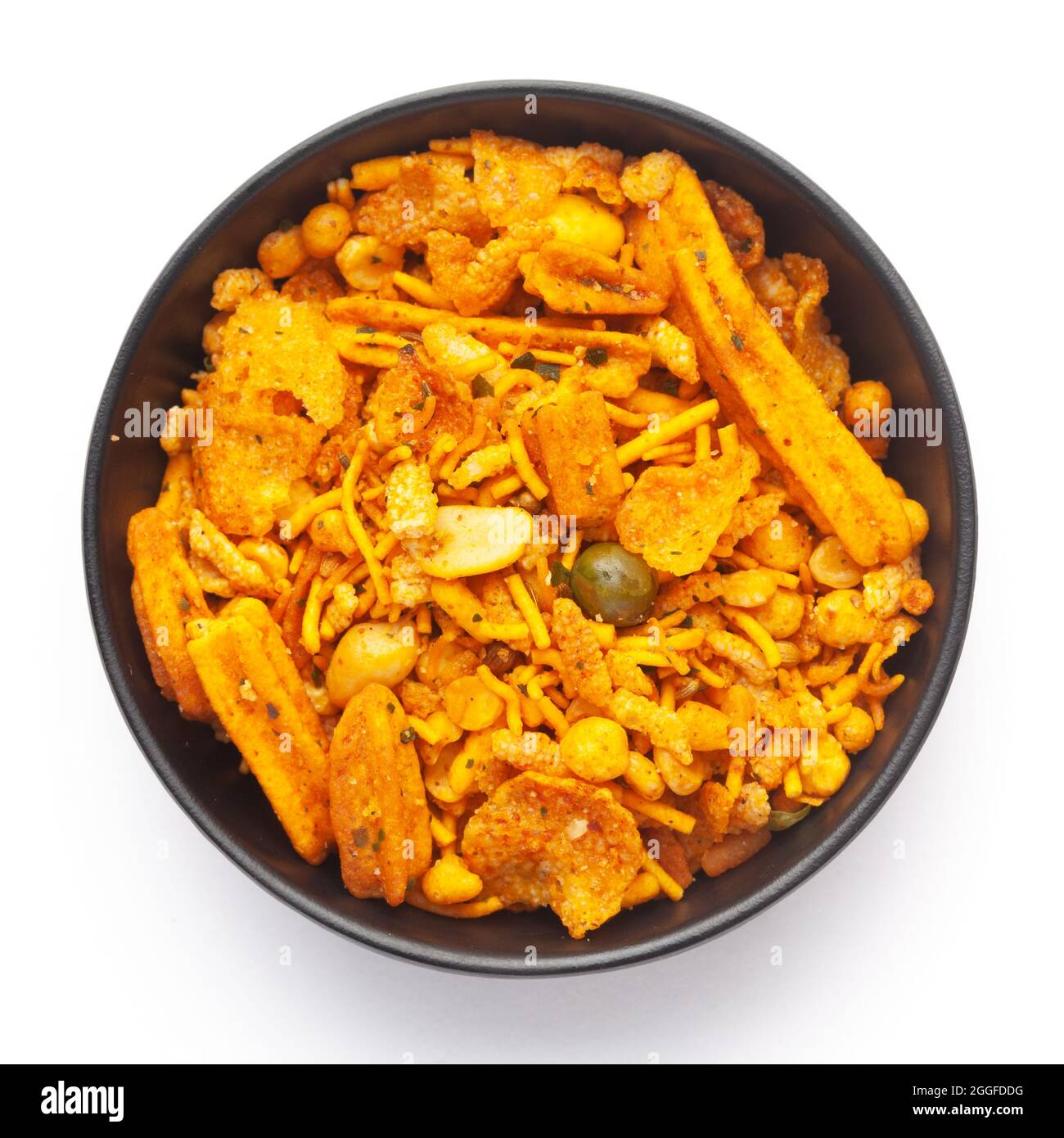 Close up of Teekha Meetha crunchy spicy Indian namkeen (snacks) on a ceramic black bowl. Top view Stock Photo