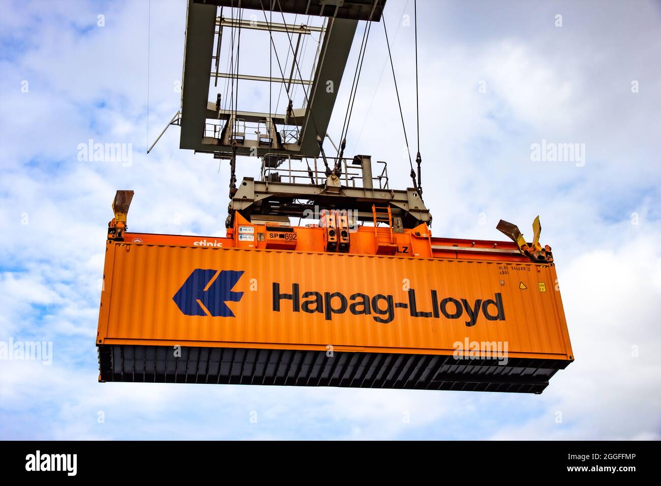Crane operator picking up a Hapag-Lloyd sea container in the Port of Rotterdam. September 6, 2015 Stock Photo