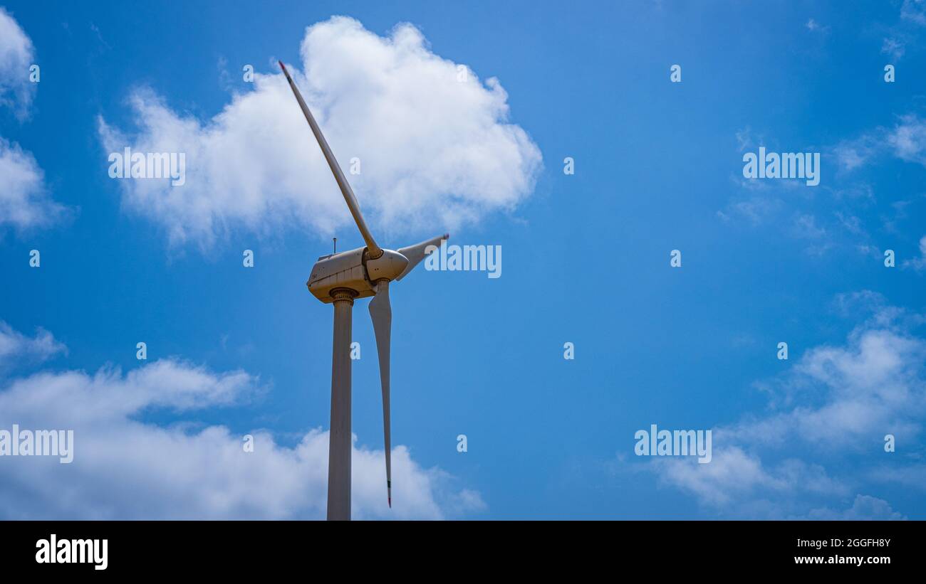wind turbine with blue sky and clouds. clean energy Stock Photo - Alamy