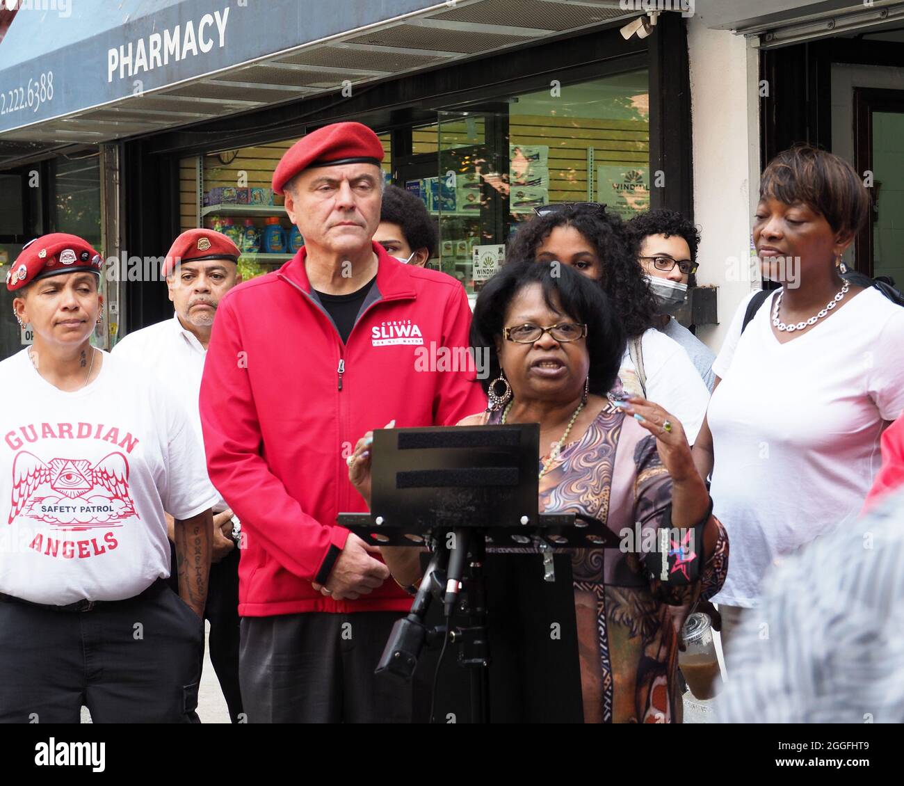 New York, New York, USA. 31st Aug, 2021. Carmen Quinones, President of the Douglass Houses Tenant Association for a Press Conference, with Mayoral Candidate Curtis Sliwa at the crime scene at the corridor of West 104th St - West 105th on Columbus Ave that become an Alley of Gunshots and Shootings. Two people were shot, including an 81-year-old innocent bystander, outside NYC barbershop. (Credit Image: © Debra L. Rothenberg/ZUMA Press Wire) Stock Photo