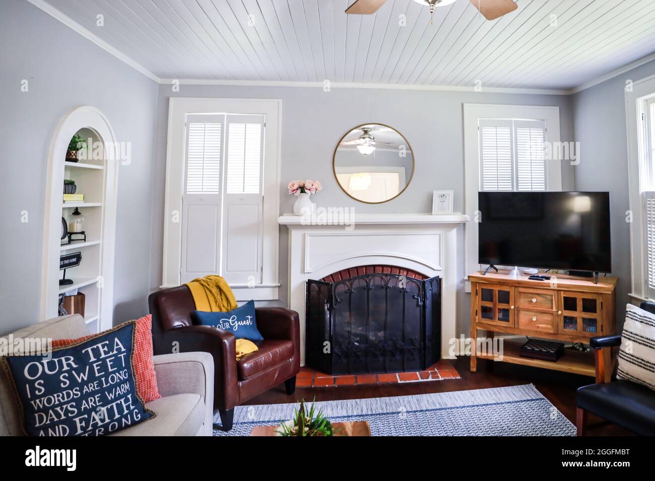A clean and classic airy living room of a small cottage short term rental Stock Photo