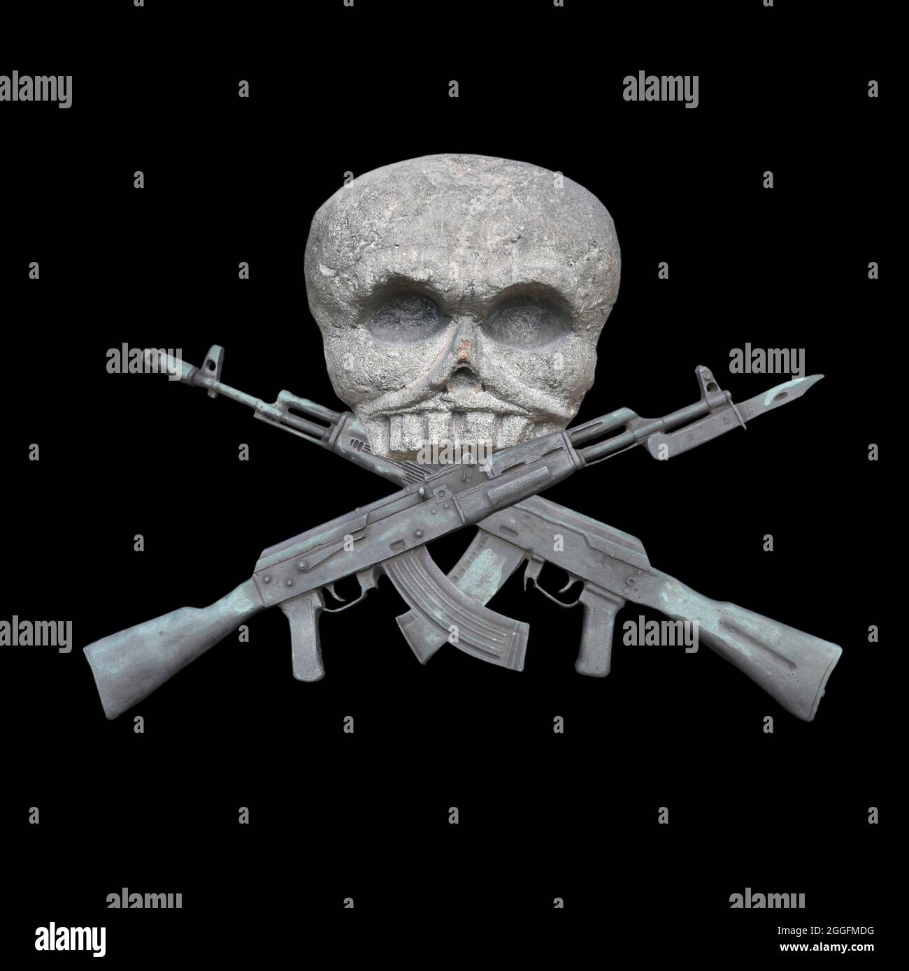 View of the skull with crossed Kalashnikovs. Isolated on dark background Stock Photo