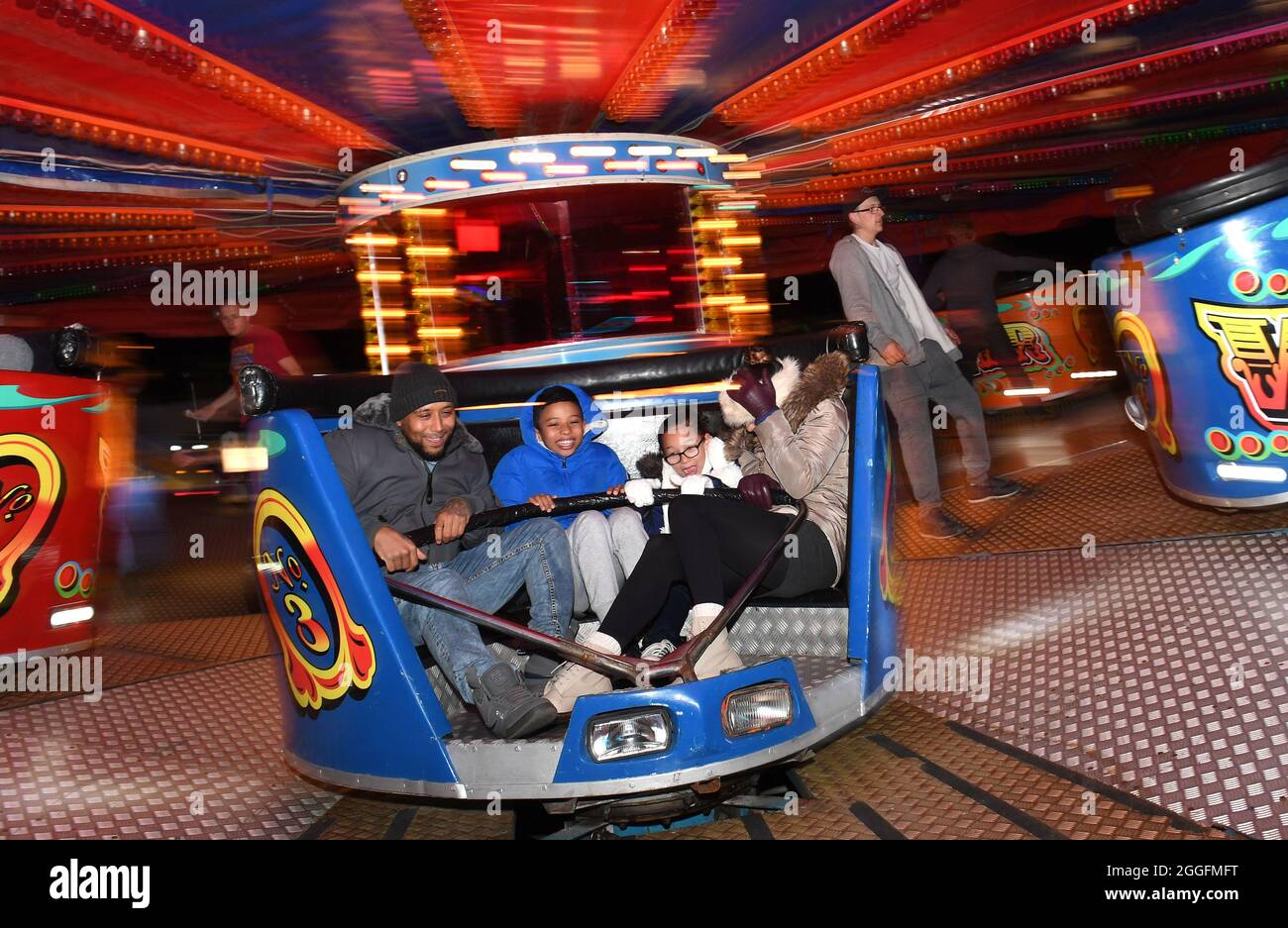 Family on fairground  funfair ride Birmingham, Britain, Uk Stock Photo