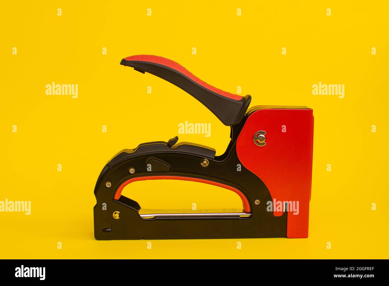 construction mechanical stapler for covering furniture. close-up. Stock Photo
