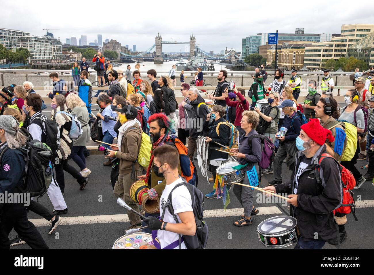 London, UK. 30th Aug, 2021. London, UK 30 8 21 Members of Extinction Rebellion march from The Shard to Tower Bridge where supporters climb on top of a caravan and block the road. Extinction Rebellion Credit: Mark Thomas/Alamy Live News Stock Photo