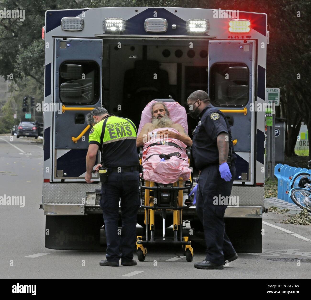 New Orleans, United States. 31st Aug, 2021. A man is loaded into an ambulance in downtown New Orleans, Tuesday, August 31, 2021. Oppressive heat and no power has make many in the area vulnerable to heat related Illnesses. Photo by AJ Sisco/UPI Credit: UPI/Alamy Live News Stock Photo