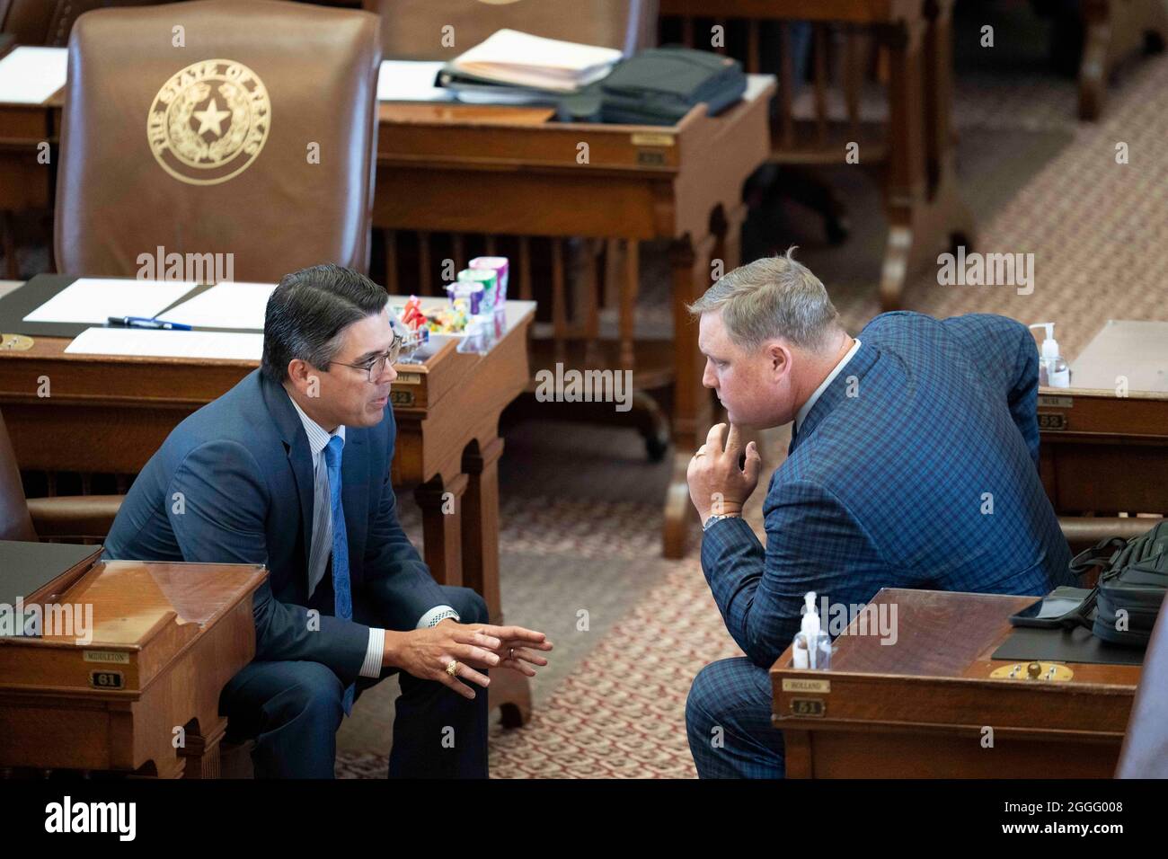 Rep. Chris Paddie, R-Marshall, l, chats with Rep. Justin Holland, R-Rockwall, as the House nears the end of the second-called special session of the 87th Texas Legislature. The 30-day sessions ends Sunday. Credit: Bob Daemmrich/Alamy Live News Stock Photo