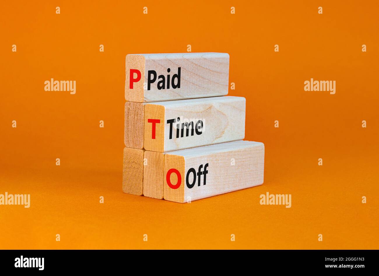 PTO, Paid time off symbol. Wooden blocks with concept words 'PTO, Paid