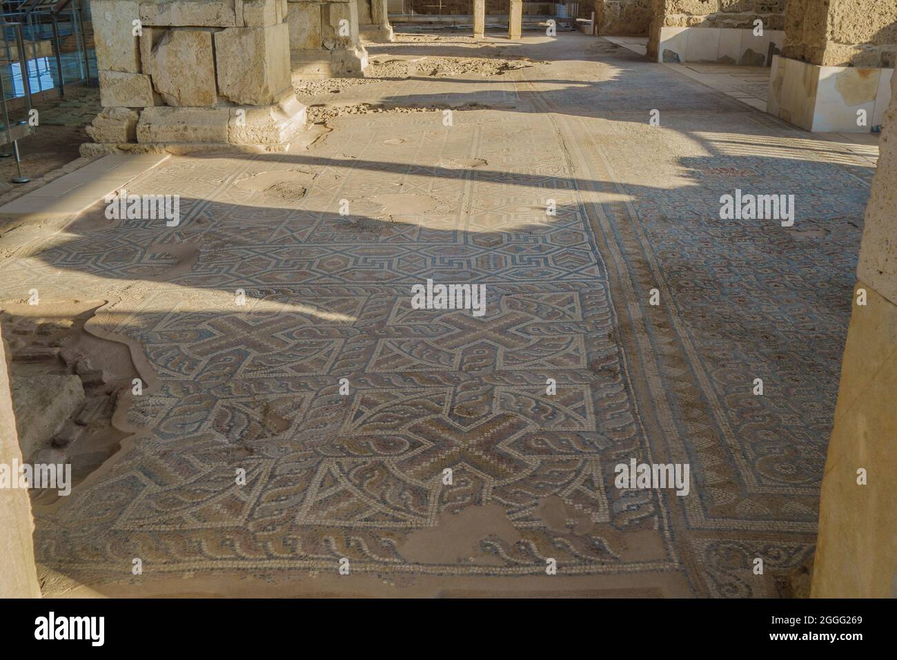 Remains of ancient floor mosaics in ruined church. Ornaments are mixing geometrical elements & early Christian symbols. Authors are unknown. Shot in a Stock Photo