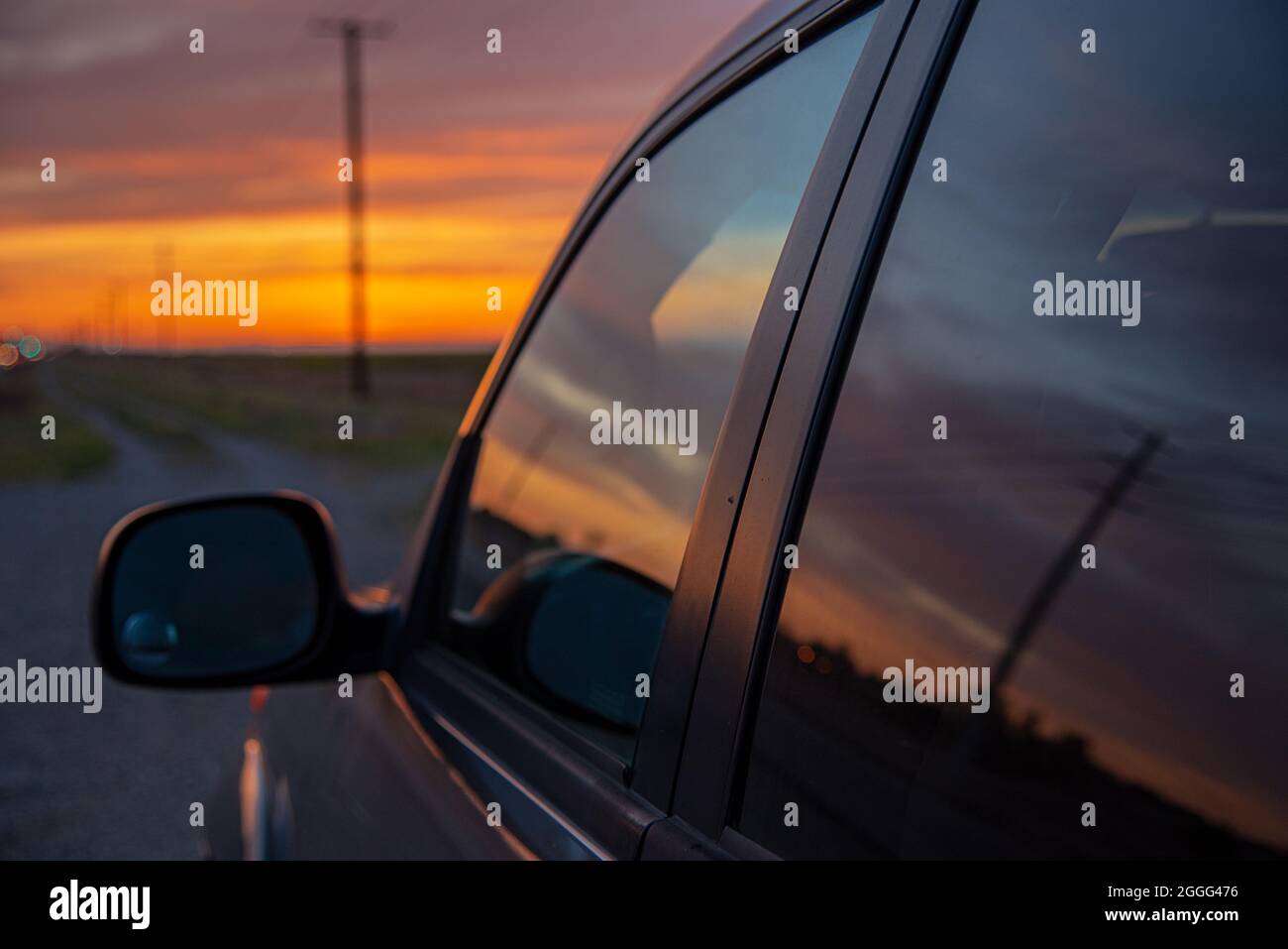 Sunset in Car Window in the Country Stock Photo