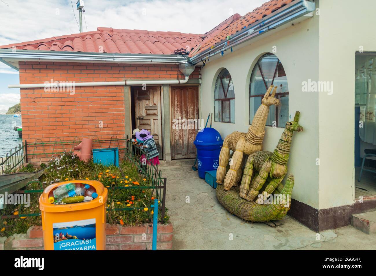 SAN PEDRO DE TIQUINA, BOLIVIA - MAY 11, 2015: House with reed objects in San Pedro village at the Tiquina strait at Titicaca lake, Bolivia Stock Photo
