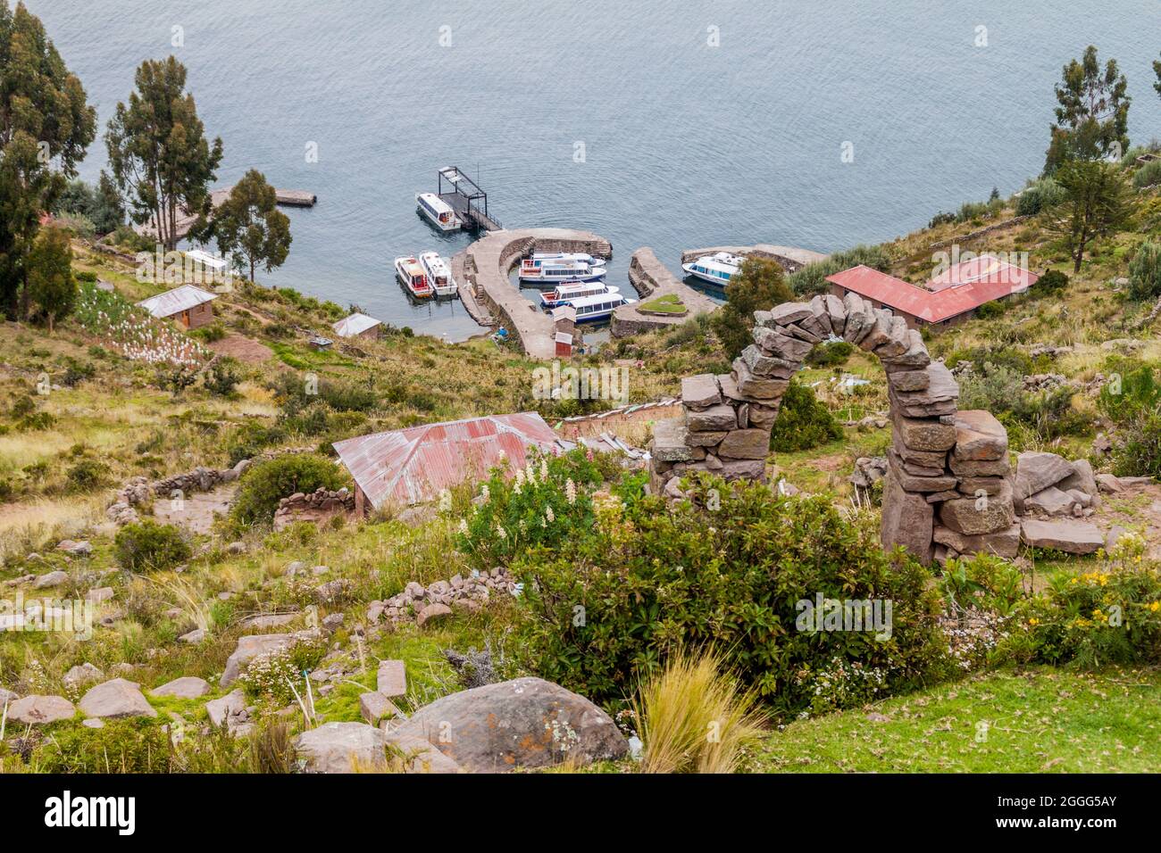 Small pier with boats on Taquile island in Titicaca lake, Peru Stock Photo