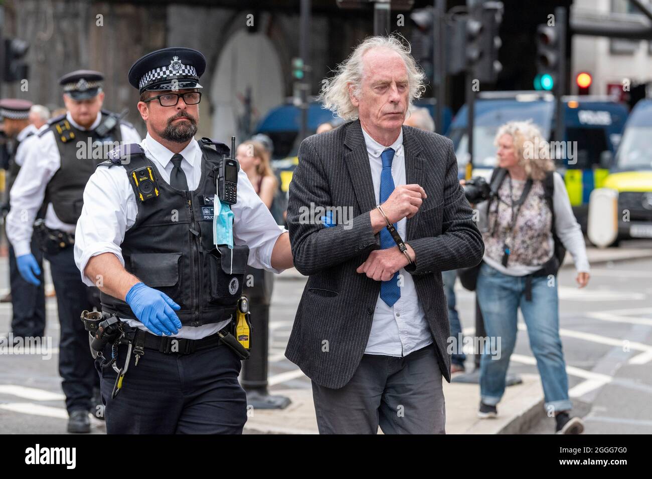 London, UK. 31st Aug, 2021. Police arrest a protester who was removed from an open top bus used to block the junction on the south side of London Bridge on the 9th day of the Impossible Rebellion.The protest group by Extinction Rebellion are undertaking two weeks of civil disobedience, demonstrations and protests. Credit: SOPA Images Limited/Alamy Live News Stock Photo