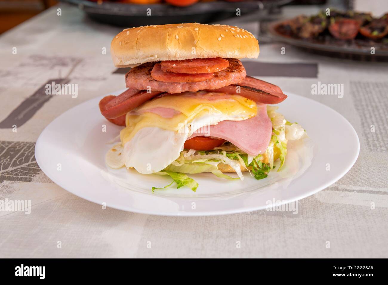 Burger with a lot of protein. Fried egg, pork, sausage, ham and double
