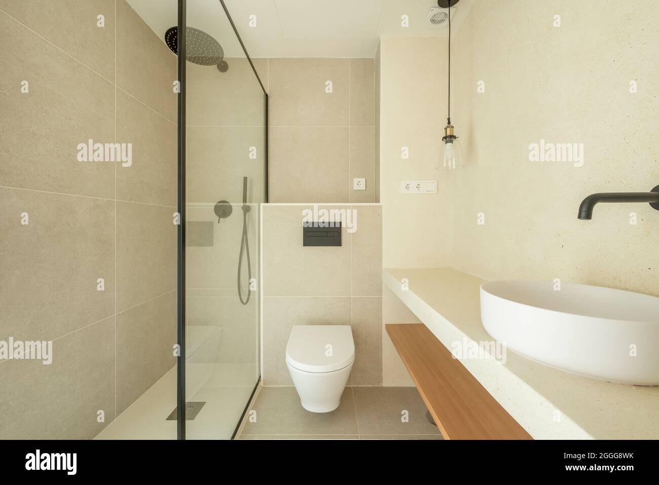 Minimalist decorated bathroom with shower, toilet and toilet in a