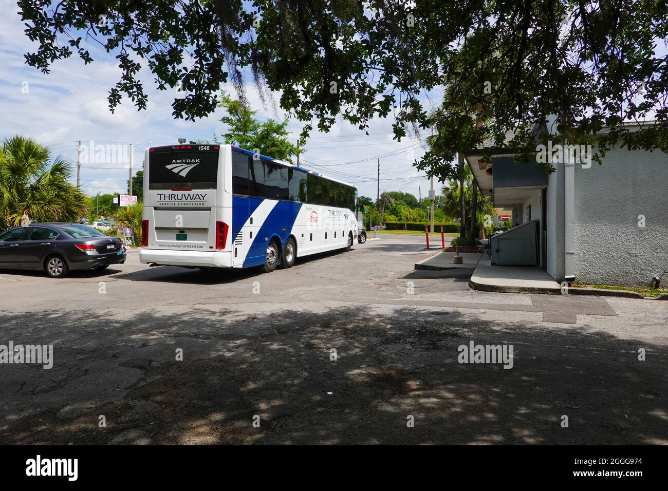 Amtrak bus parked in the Greyhound parking lot. Connection to the Jacksonville train station for cities of Ocala, Gainesville, and Waldo, Florida. Stock Photo