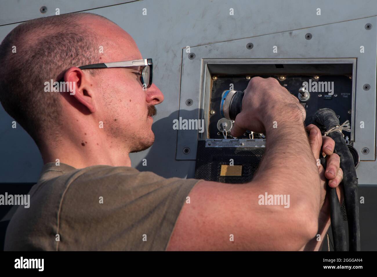 Senior Airman Anthony Taylor, 386th Expeditionary Aircraft Maintenance Squadron avionics specialist, conducts routine pre-flight program checks at Ali Al Salem Air Base, Kuwait June 10, 2020. The 386TH EAMXS ‘White AMU’ is part of the 386th Expeditionary Maintenance Group, which directs maintenance operations in an expeditionary tactical airlift and electronic attack environment within the U.S. Central Command Area of Responsibility. (U.S. Air Force photo by Tech. Sgt. Alexandre Montes) Stock Photo