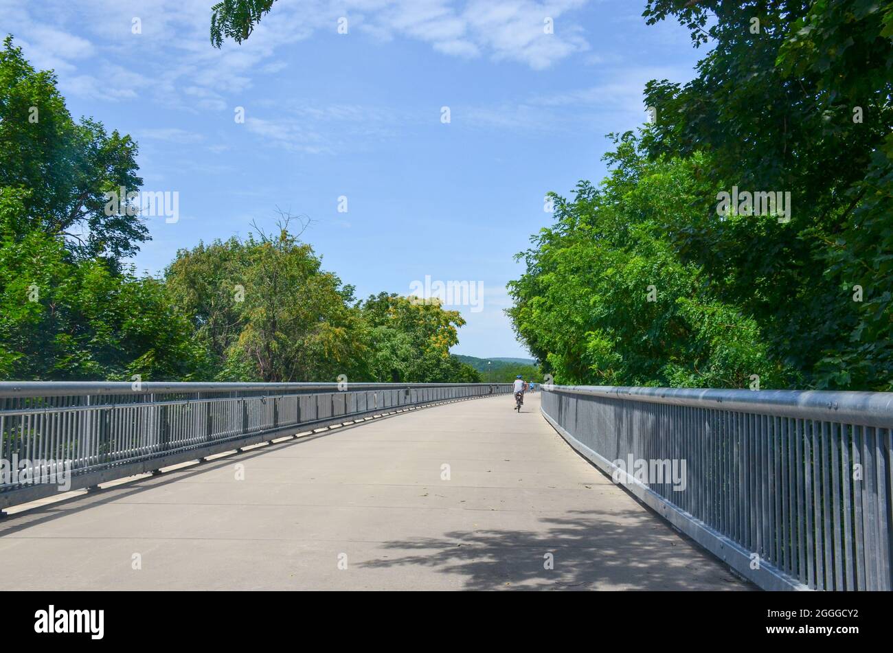 Walkway Over the Hudson State Historic Park, the world's longest pedestrian park. Biking on the bridge. Poughkeepsie, New York, USA.  July 2021. Stock Photo