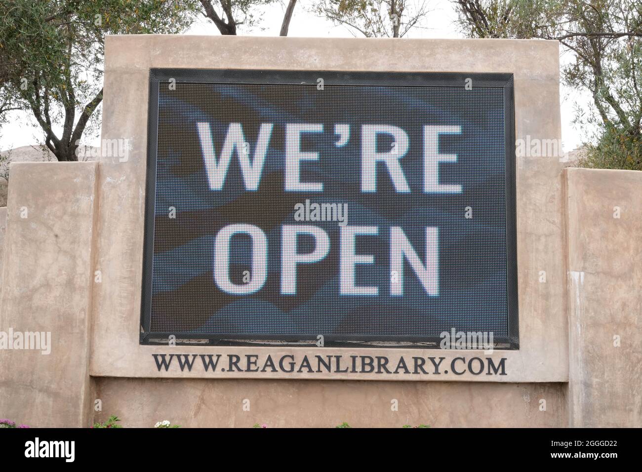 A 'We're Open' sign at the entrance to the  Ronald Reagan Presidential Library, Wednesday, Aug. 18, 2021, in Simi Valley, Caif. Stock Photo