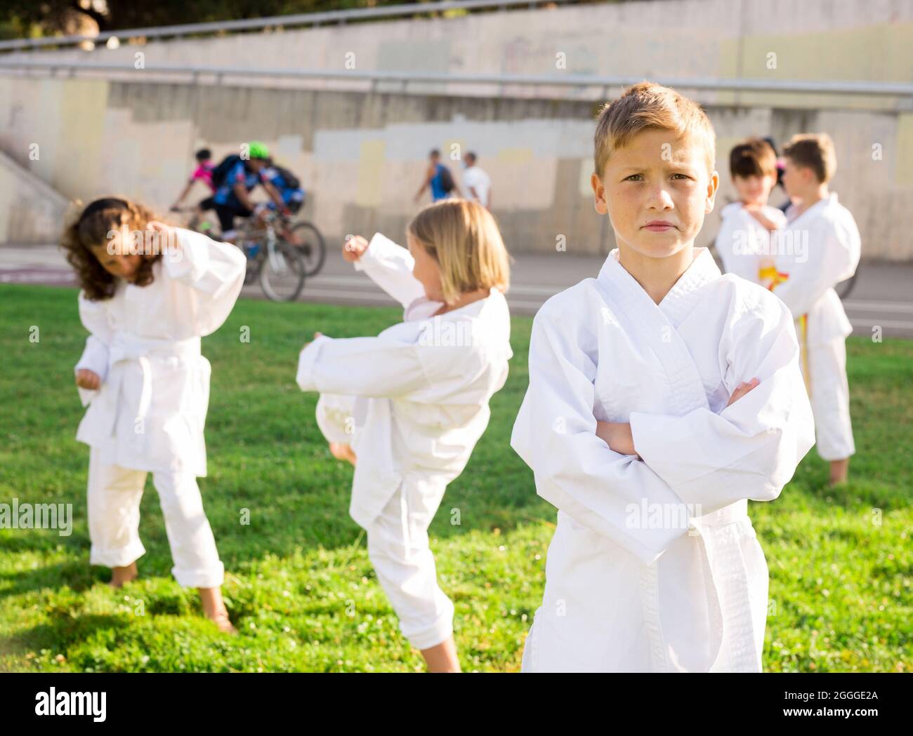 Boy throws a punch at martial arts practice Stock Photo Alamy