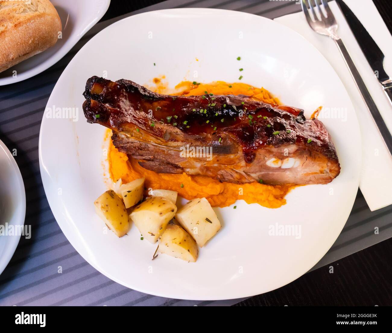 Pork ribs with BBQ sauce and sweet potato Stock Photo
