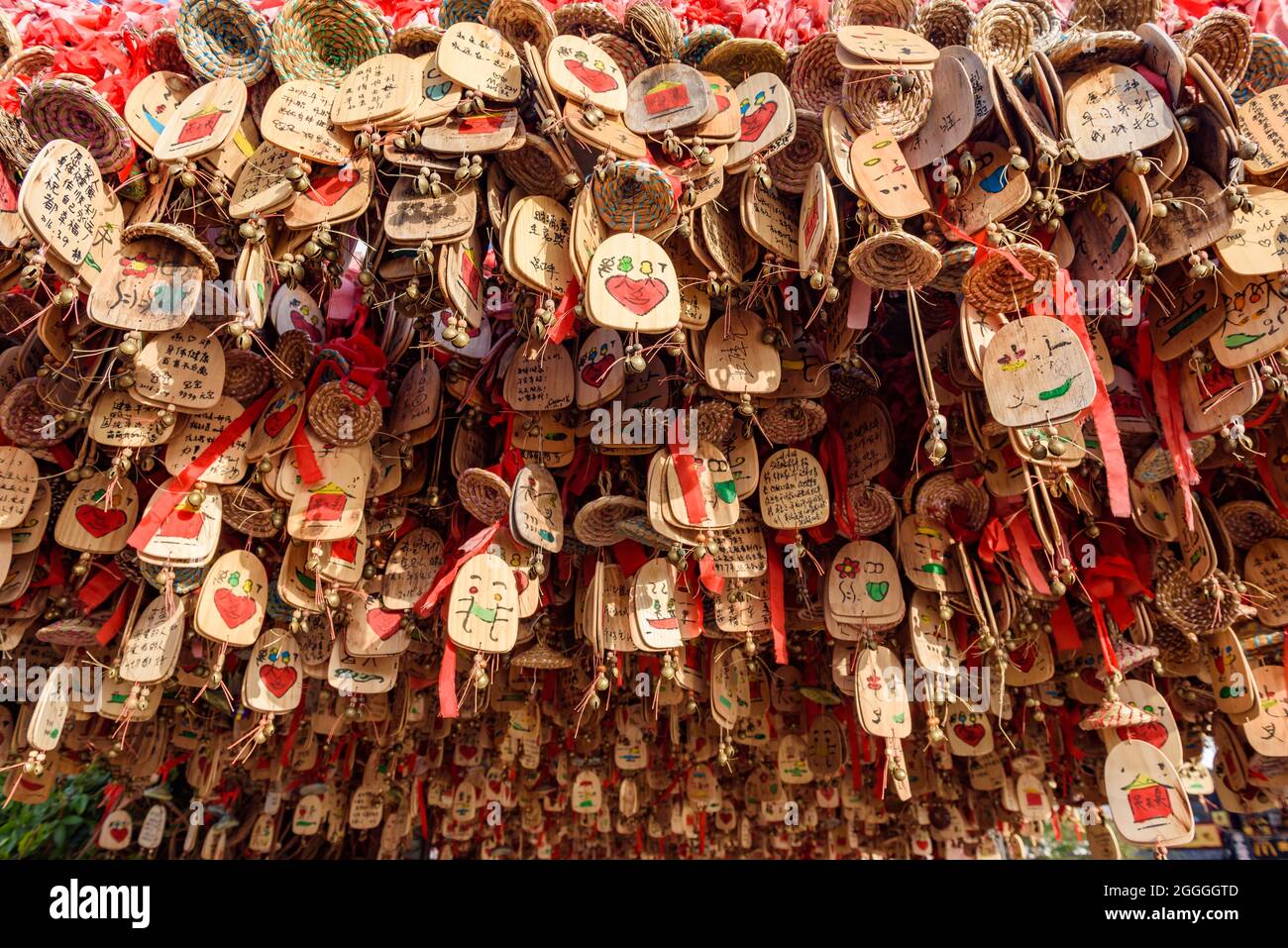 Yunnan, China - 22 March 2016: Wooden good luck charms writen with various wishes. Lijiang ancient town. Stock Photo