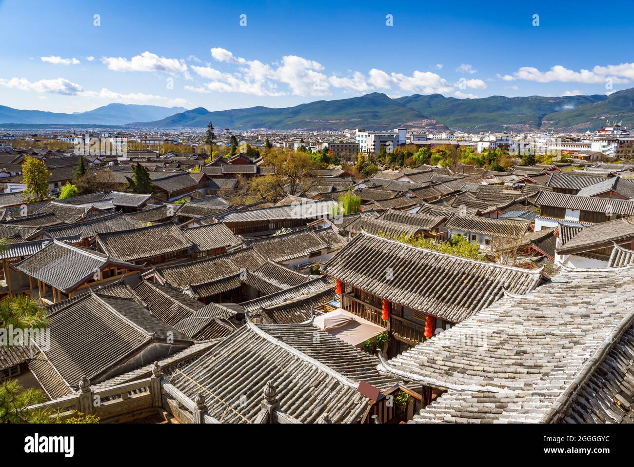 Beautiful cityscape of Lijiang ancient town with view of tiled roofs of ancient shophouses, Yunan, China. Stock Photo