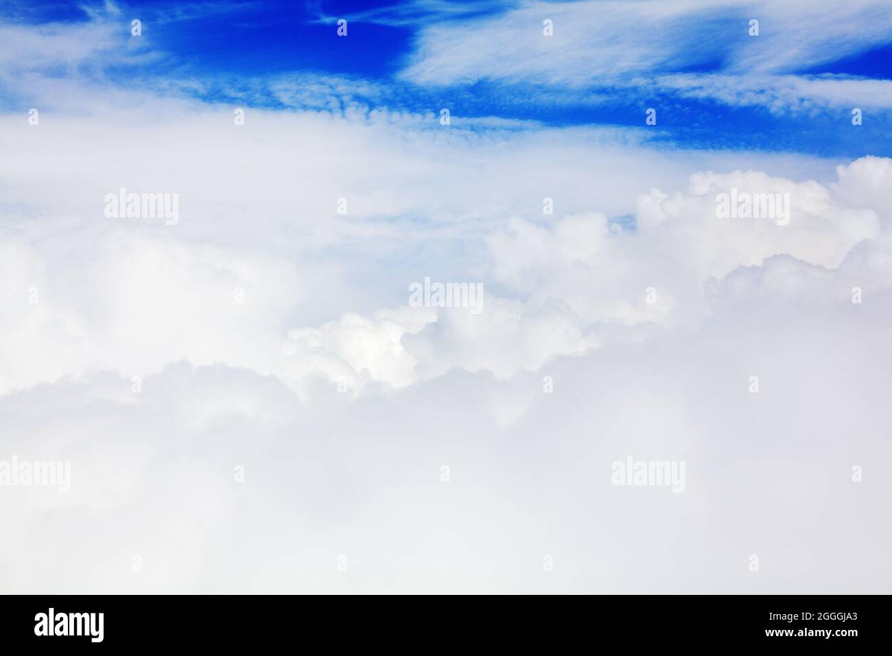 White cumulus clouds blue sky background closeup beautiful aerial cloudscape backdrop, cloudy skies from above, sunny heaven fluffy cloud texture, air Stock Photo