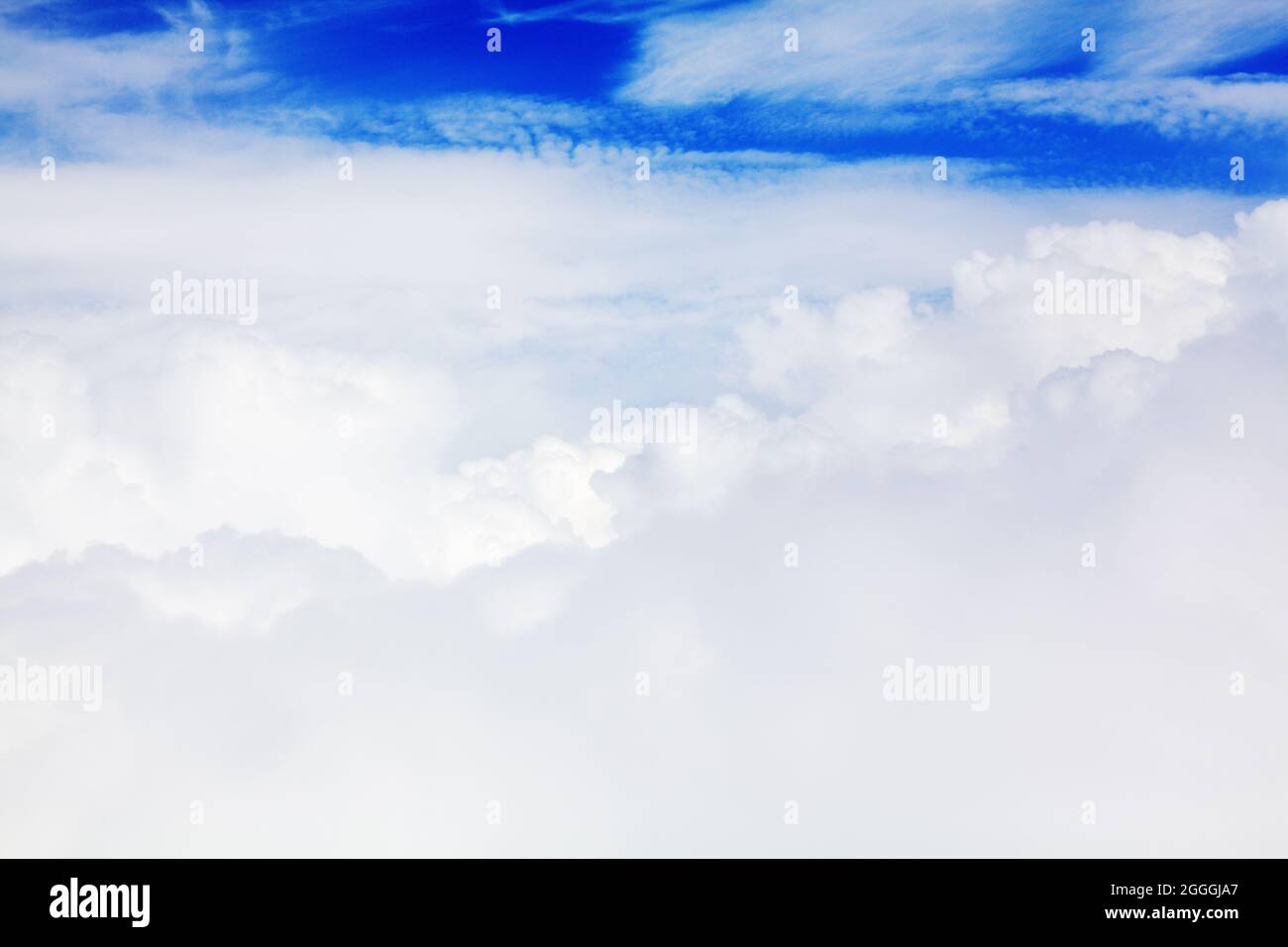 White cumulus clouds blue sky background closeup beautiful aerial cloudscape backdrop, cloudy skies from above, sunny heaven fluffy cloud texture, air Stock Photo