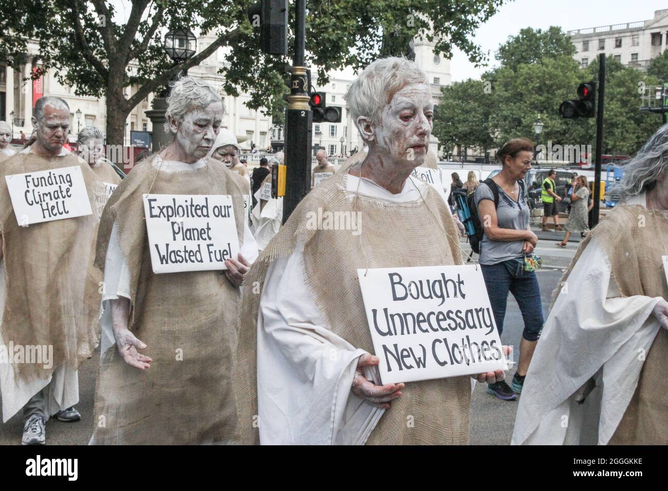 London, United Kingdom. 24th August 2021. Extinction Rebellion Penitents march through London, from Piccadilly to Parliament Square. Unlike other XR groups whose actions are mainly performative, the Penitents bring a profoundly contemplative mood to the rebellion. Their march is an inner meditation. The penitents carry the burden of all human crimes against the environment and humans and a placard describing their own sin. Stock Photo