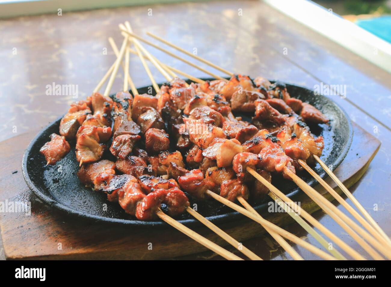 Goat satay or sate kambing in the hot plate Stock Photo