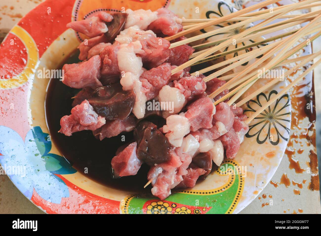 Raw goat satay or mutton satay dish, originally from Indonesia. Stock Photo
