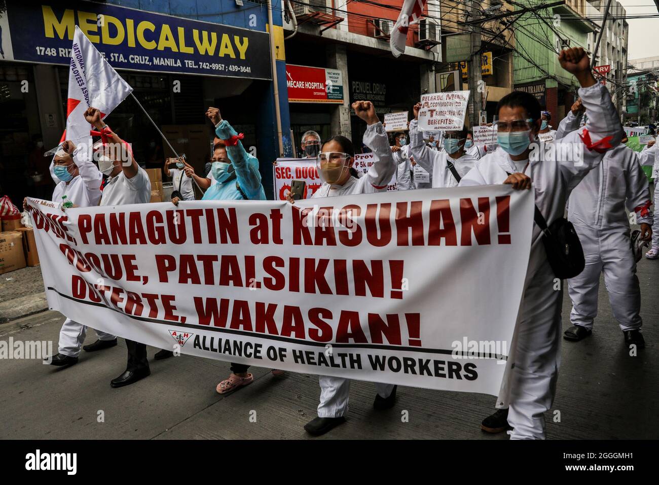September 1, 2021: Hospital workers and health activists wearing protective suits march as they protest in front of the Department of Health headquarters in Manila, Philippines. September 1, 2021. Their groups are demanding for the immediate release of Covid-19 funds allocated for support to healthcare workers in public and private hospitals and the resignation of Health Secretary Francisco Duque, who has been facing allegations of corruption in handling pandemic funds. (Credit Image: © Basilio Sepe/ZUMA Press Wire) Stock Photo