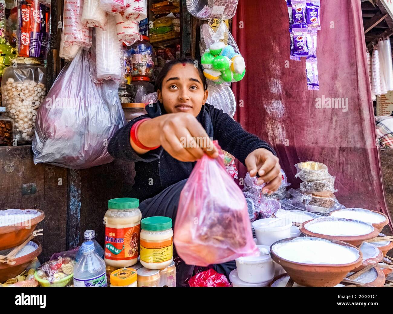 the yogurt seller, Nepalese girl selling yogurt and dairy products in a ...