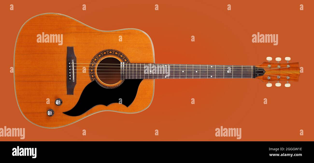 Musical instrument - Front view very rare vintage acoustic guitar folk  country isolated on a orange background Stock Photo - Alamy