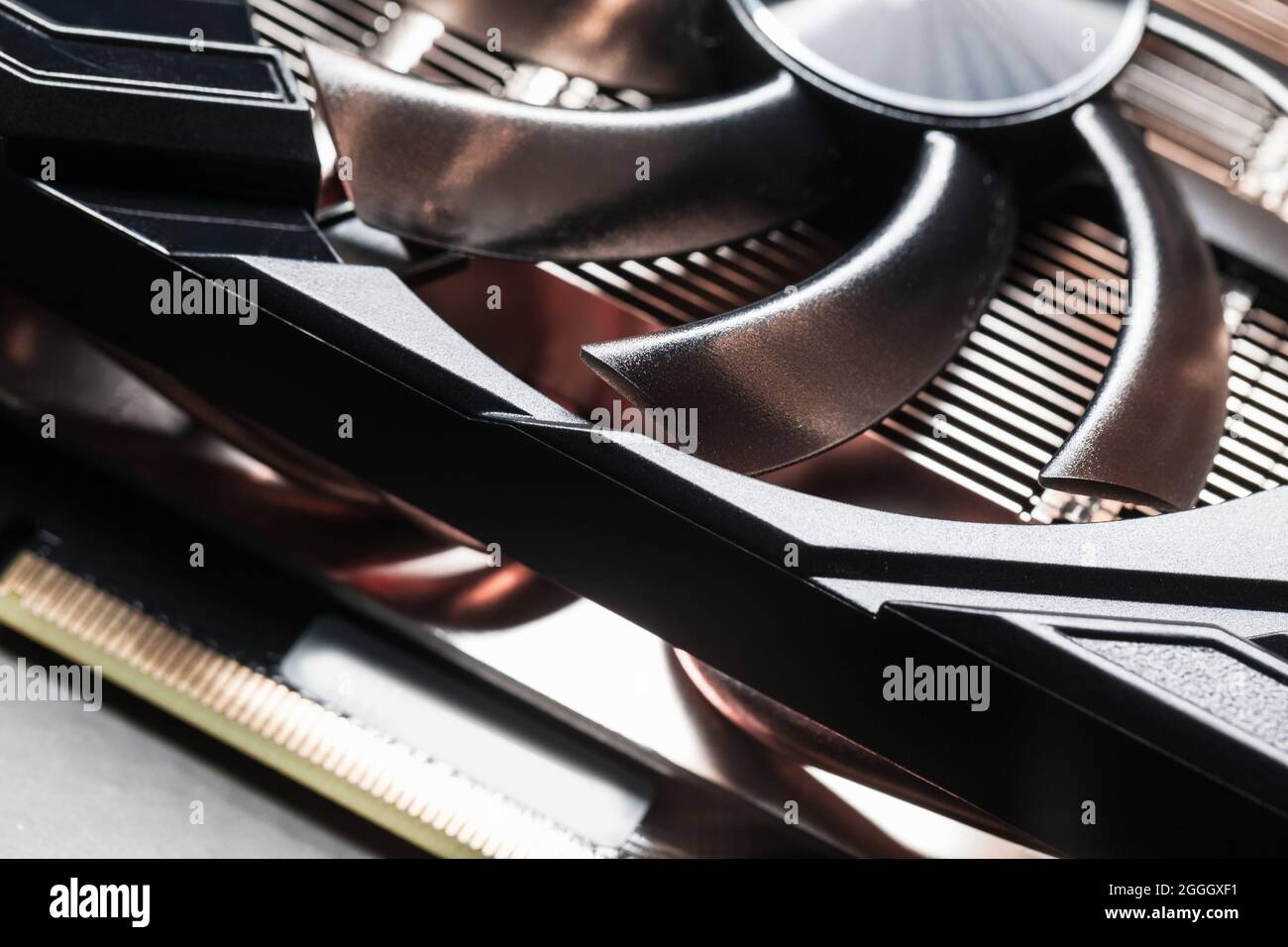 Abstract high-tech background with a black GPU cooler made of shiny plastic, close-up photo with selective focus Stock Photo