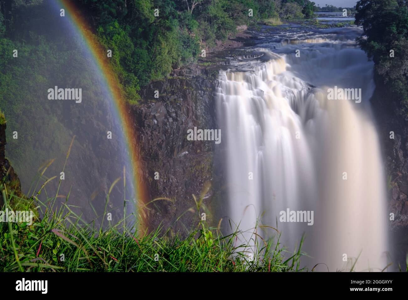 Rainbow over the Victoria Falls. Zimbabwe, Africa Stock Photo