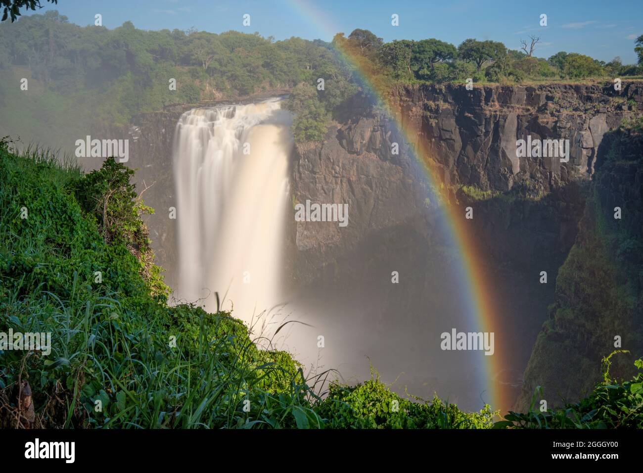 Rainbow over the Victoria Falls. Zimbabwe, Africa Stock Photo