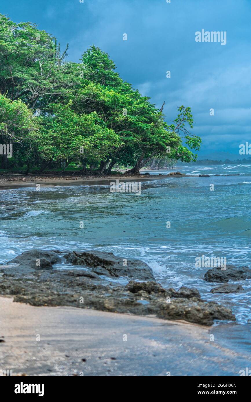 Beautiful coastline of Pacific Costa Rica. Rocks on the foreground and ...