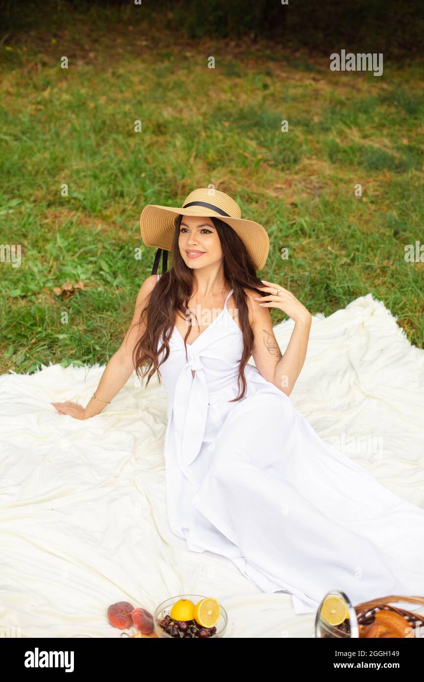 Attractive young lady posing near tree in the park Stock Photo - Alamy