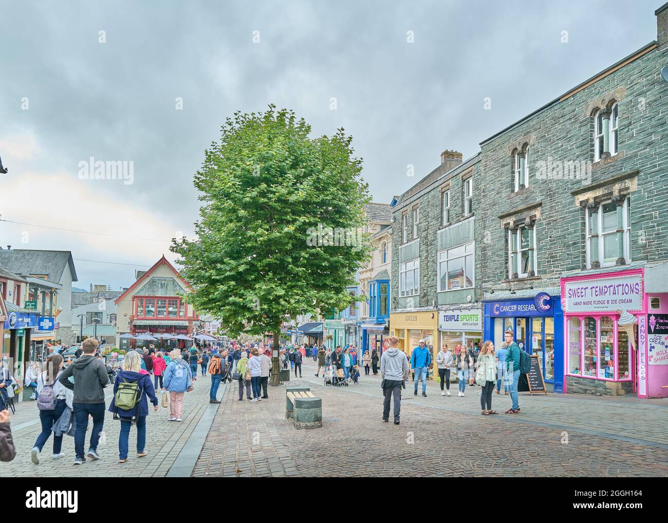 Tourists at the town centre of Keswick, Lake District, Cumbria, England, on a damp summer day. Stock Photo