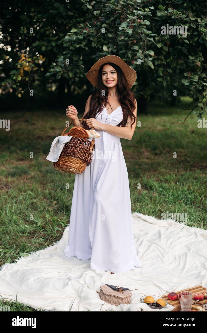 Attractive young lady posing near tree in the park Stock Photo - Alamy