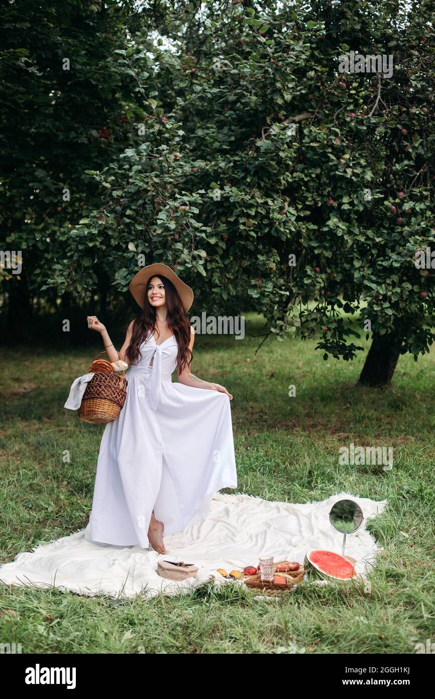 Attractive young lady posing near tree in the park Stock Photo - Alamy