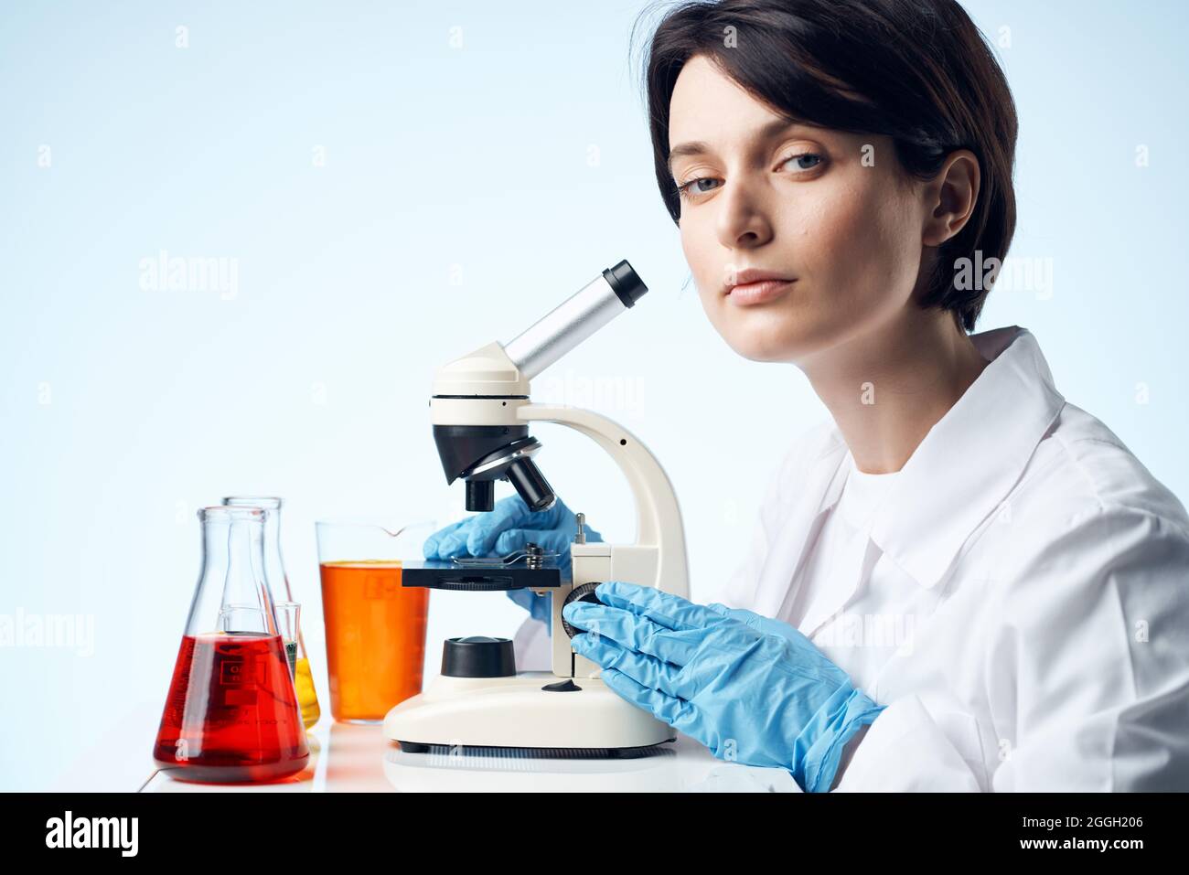female laboratory assistant chemical solution research work science