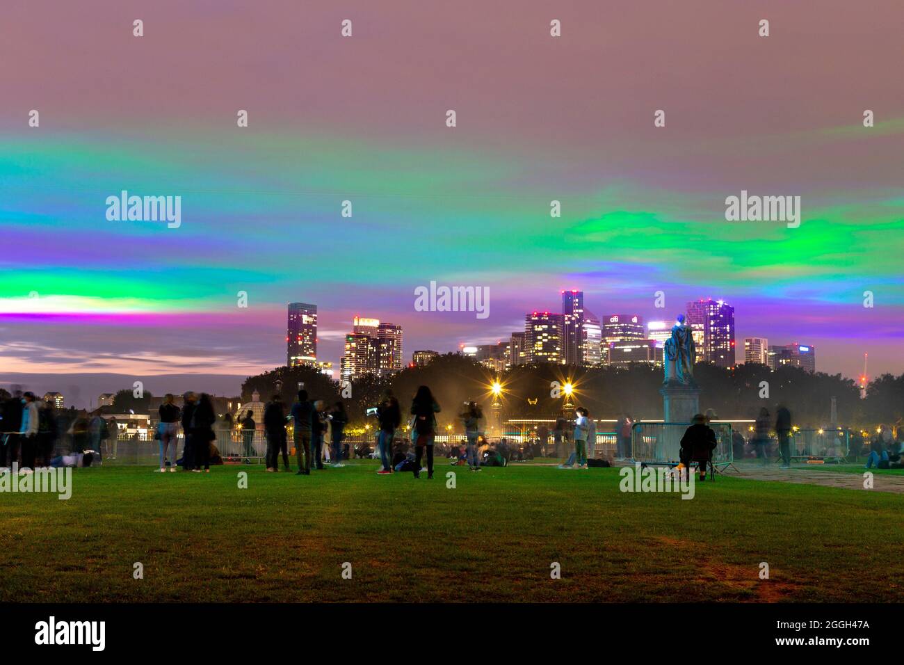 Borealis light installation by Dan Acher, Greenwich and Docklands International Festival, Canary Wharf in background, Old Royal Naval College, London Stock Photo