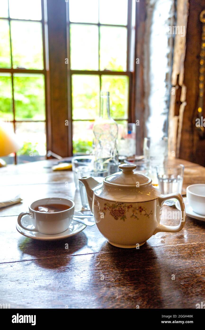 Tea pot and tea cup on a table at the Ty Gwyn Hotel Inn, Betws Y Coed, Snowdonia, Wales, UK Stock Photo