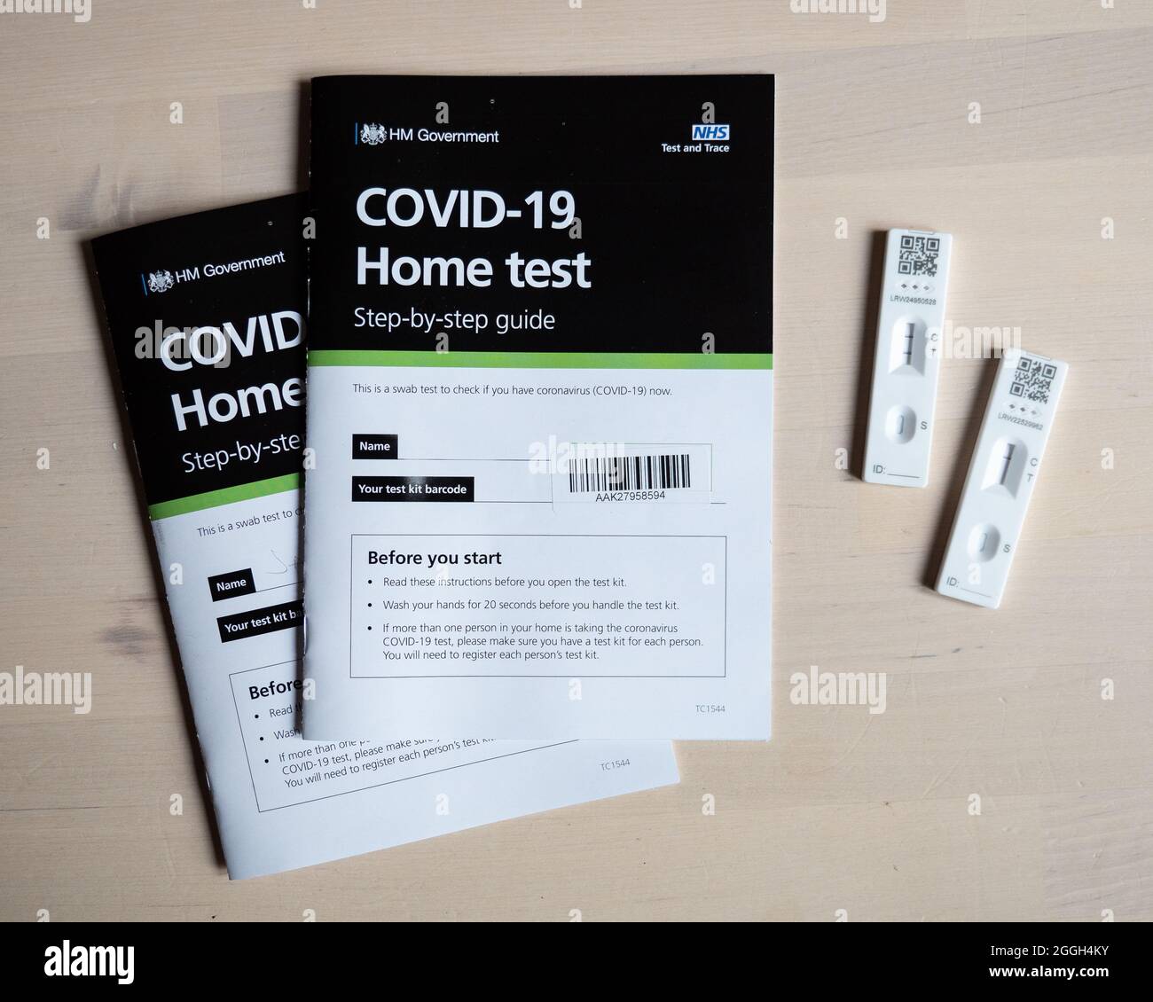 Covid-19 test results, positive and negative. A lateral flow corona virus test kit as provided by the UK government via the NHS. Stock Photo